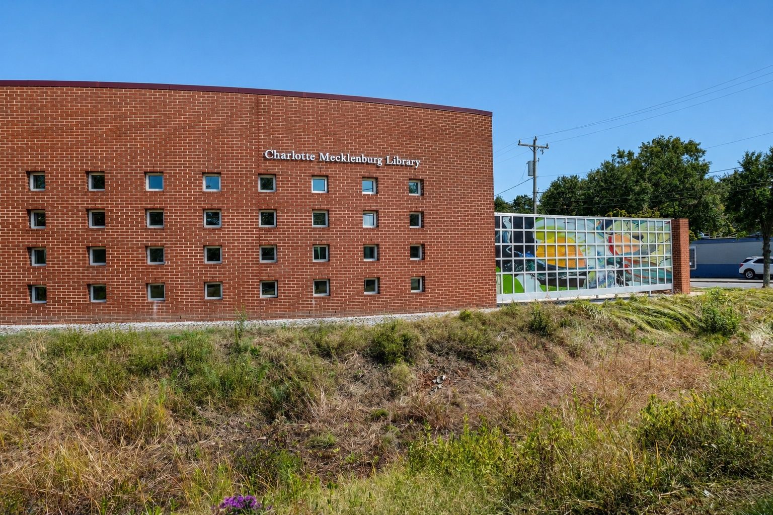 Allegra Westbrooks Regional Library exterior with established native-style landscape planting.